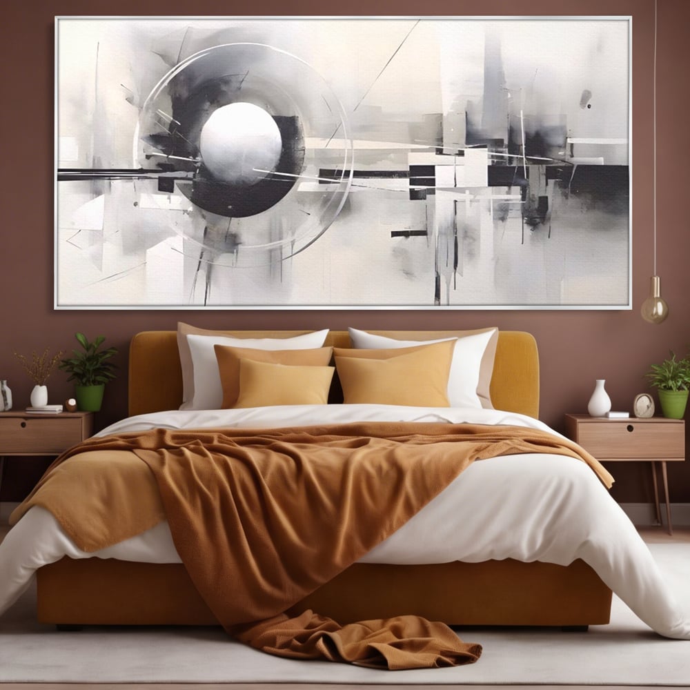 Tablou canvas cu pictura abstracta cu sfera si cercuri, in rama de aluminiu argintiu, pe perete intr-un dormitor
